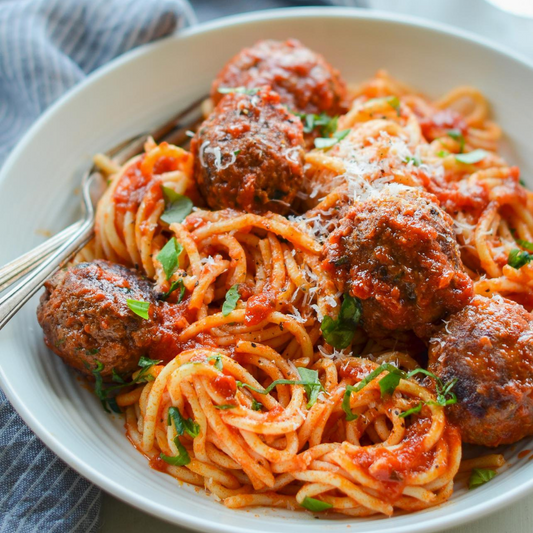 Classic homestyle Spaghetti and flavourful beef meatballs smothered in a red, velvety marinara sauce.