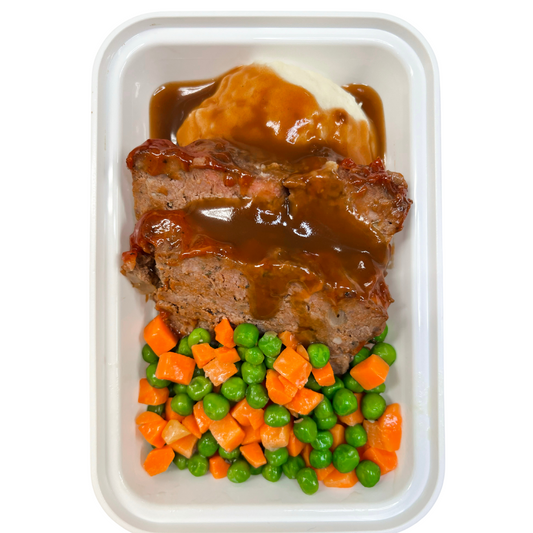 Tender juicy baked meatloaf topped with a tangy tomato glaze.&nbsp;Served with butter whipped mashed potatoes, peas &amp; carrots.