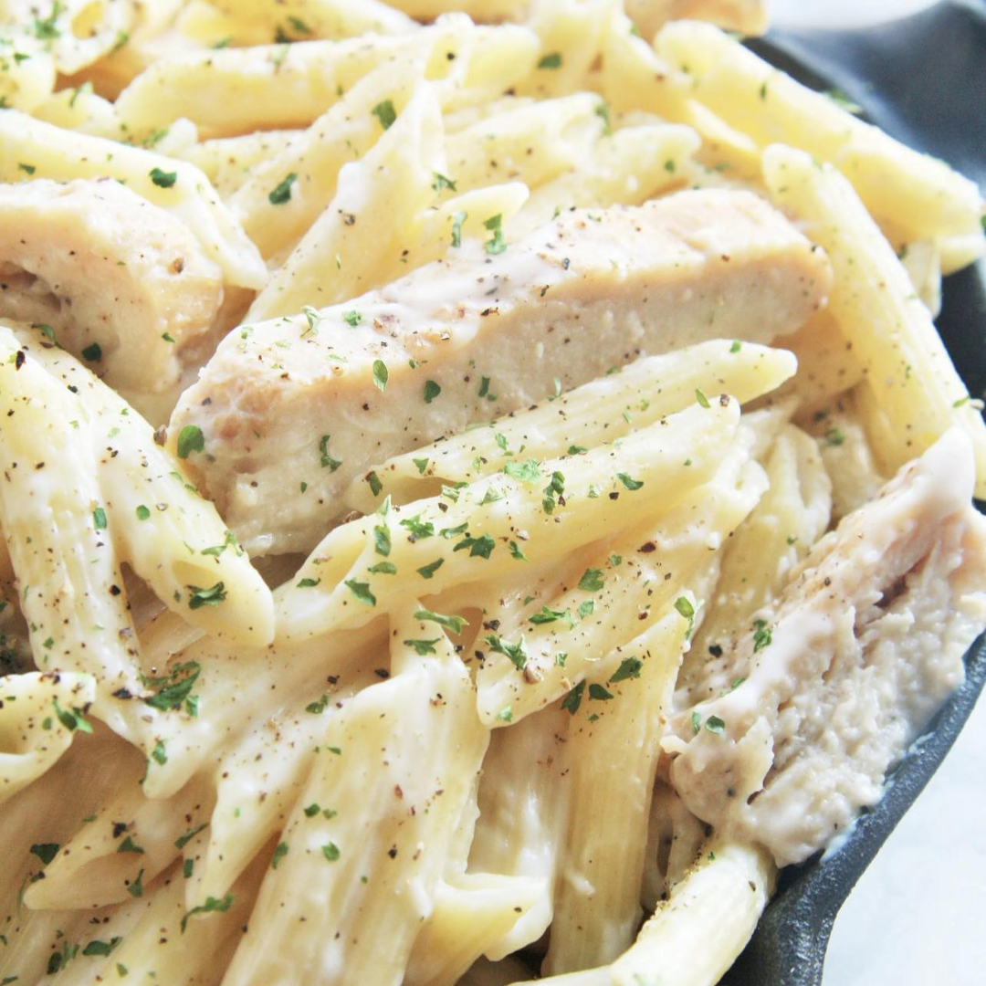 Penne Noodles and tender strips of oven-baked chicken breast tossed in a creamy garlic alfredo sauce.