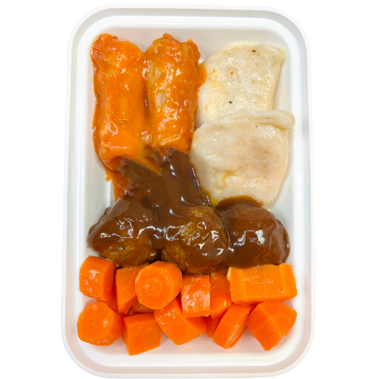 A plastic tray containing meatballs in brown gravy, perogies (a type of Eastern European dumpling), rice, cabbage rolls, and carrots, presented as a Ukrainian platter.